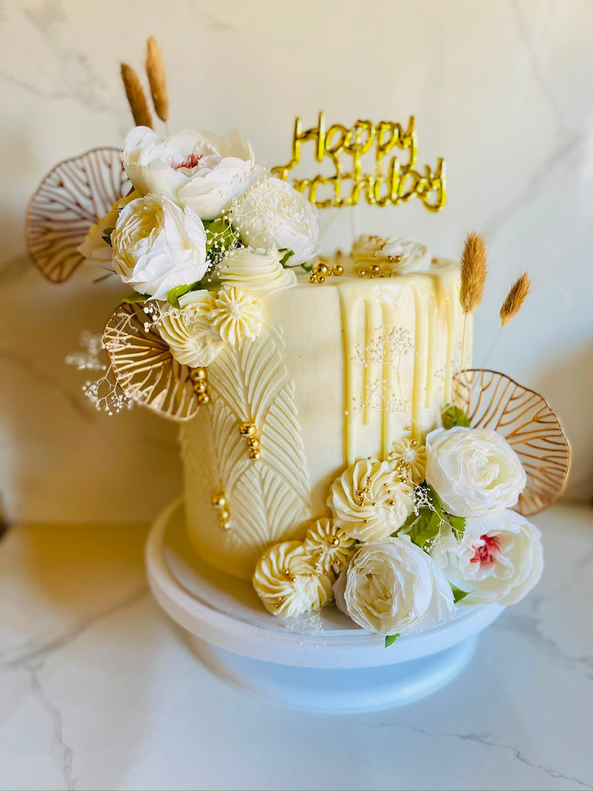 Cream Floral Drip Cake by Baked by Buhlebenkosi