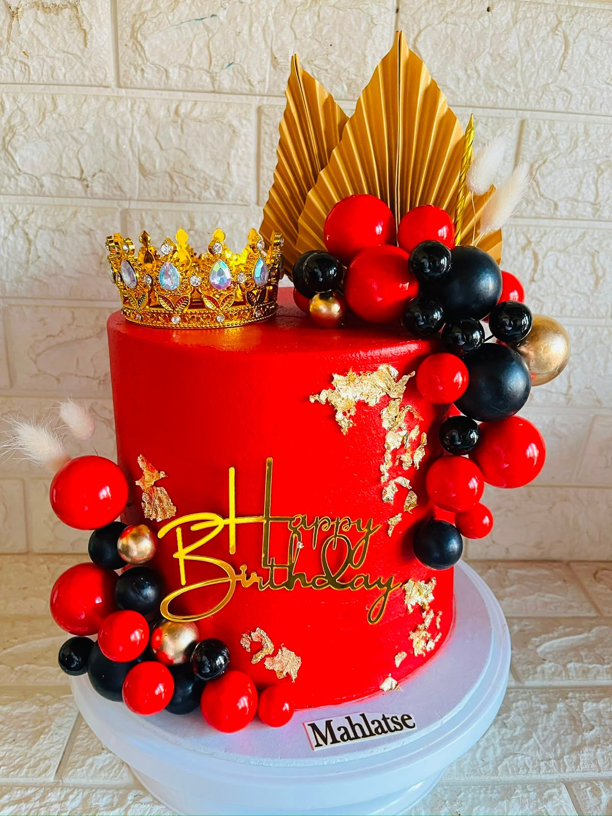 Red, Black & Gold Crown Cake by Baked by Buhlebenkosi