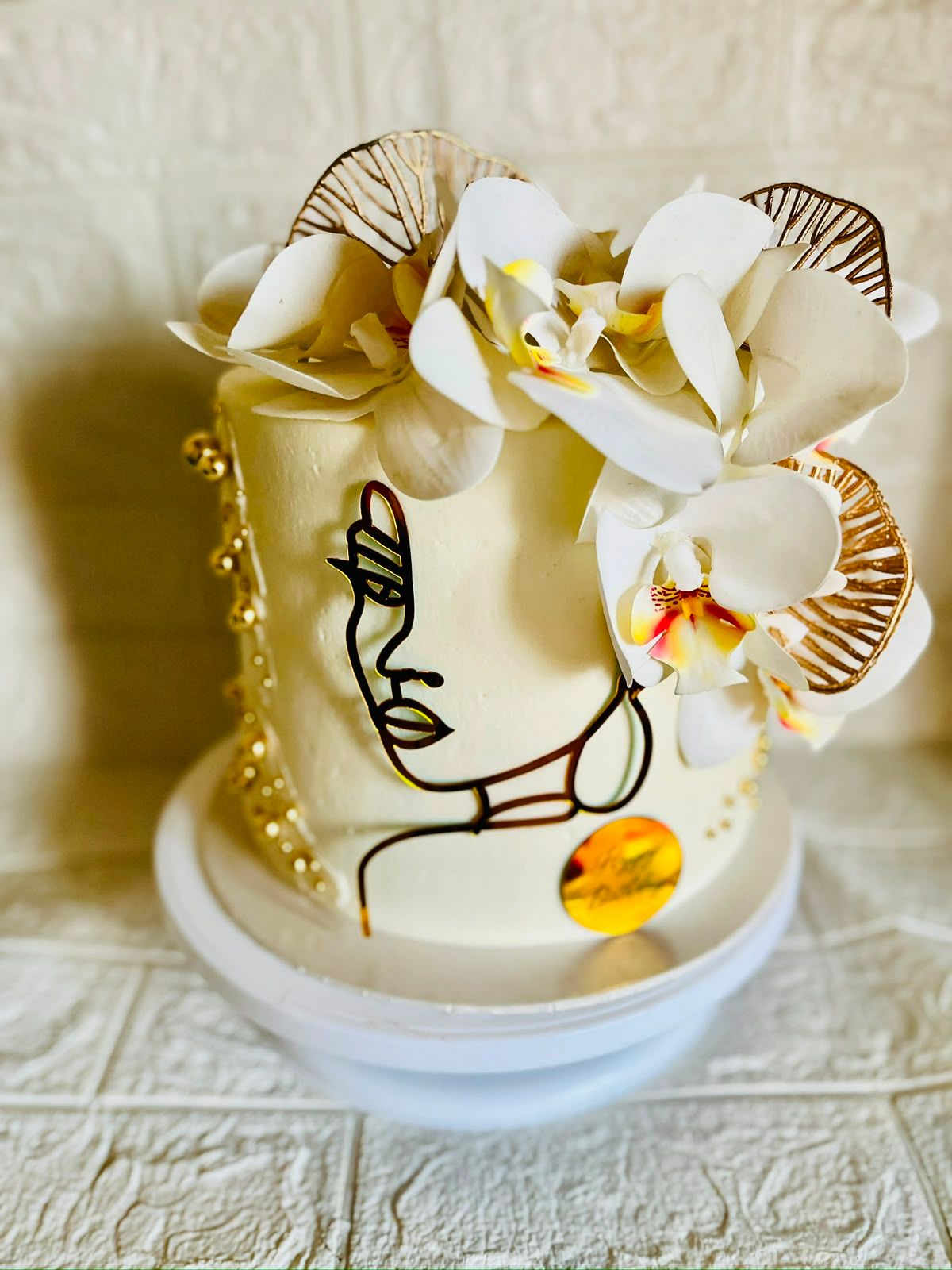 White & Gold Orchid Cake by Baked by Buhlebenkosi