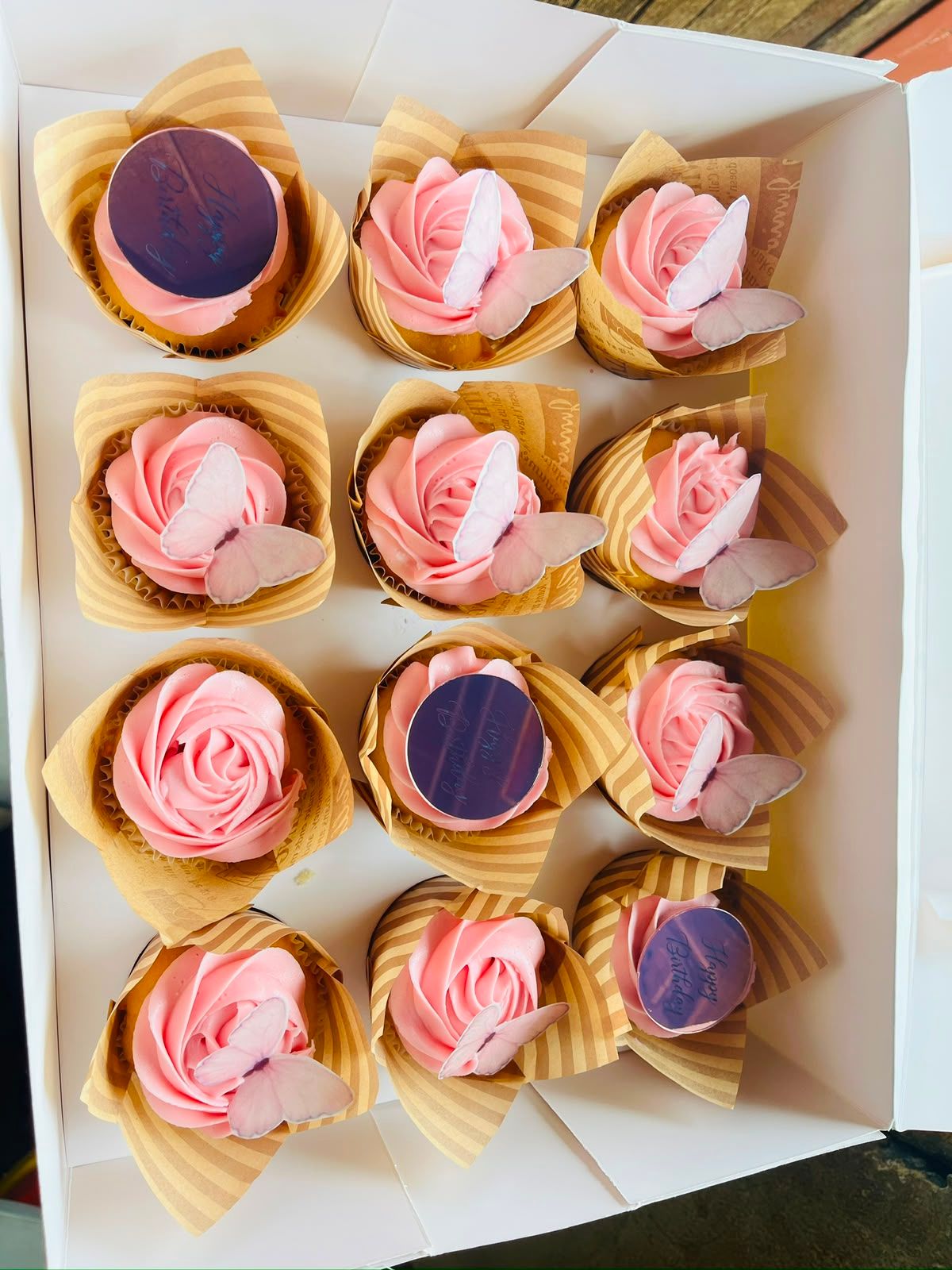 Pink rose cupcakes with butterfly toppers