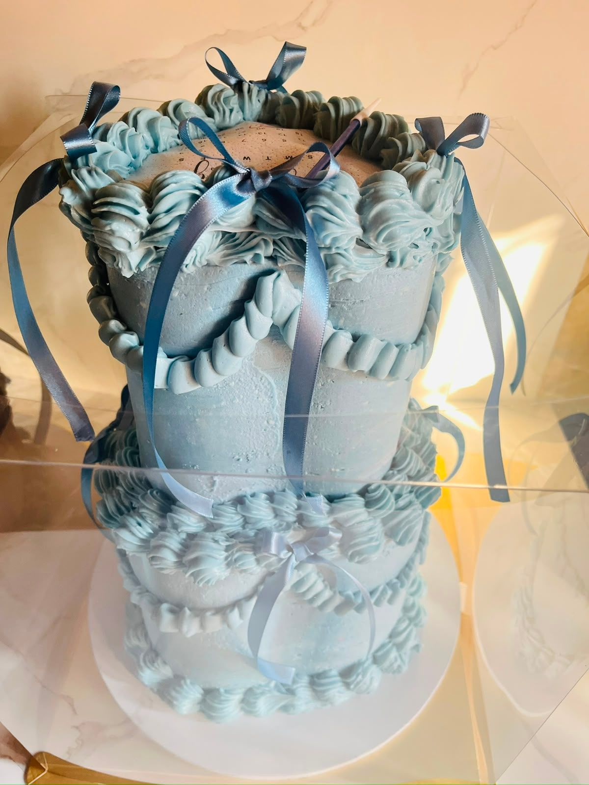 Blue Vintage Ribbon Cake by Baked by Buhlebenkosi